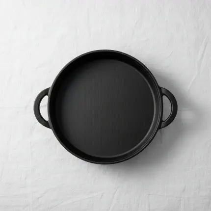 The Minimalist Culinary Instrument (Round Grill Pan W/Cast Handles 26cm)