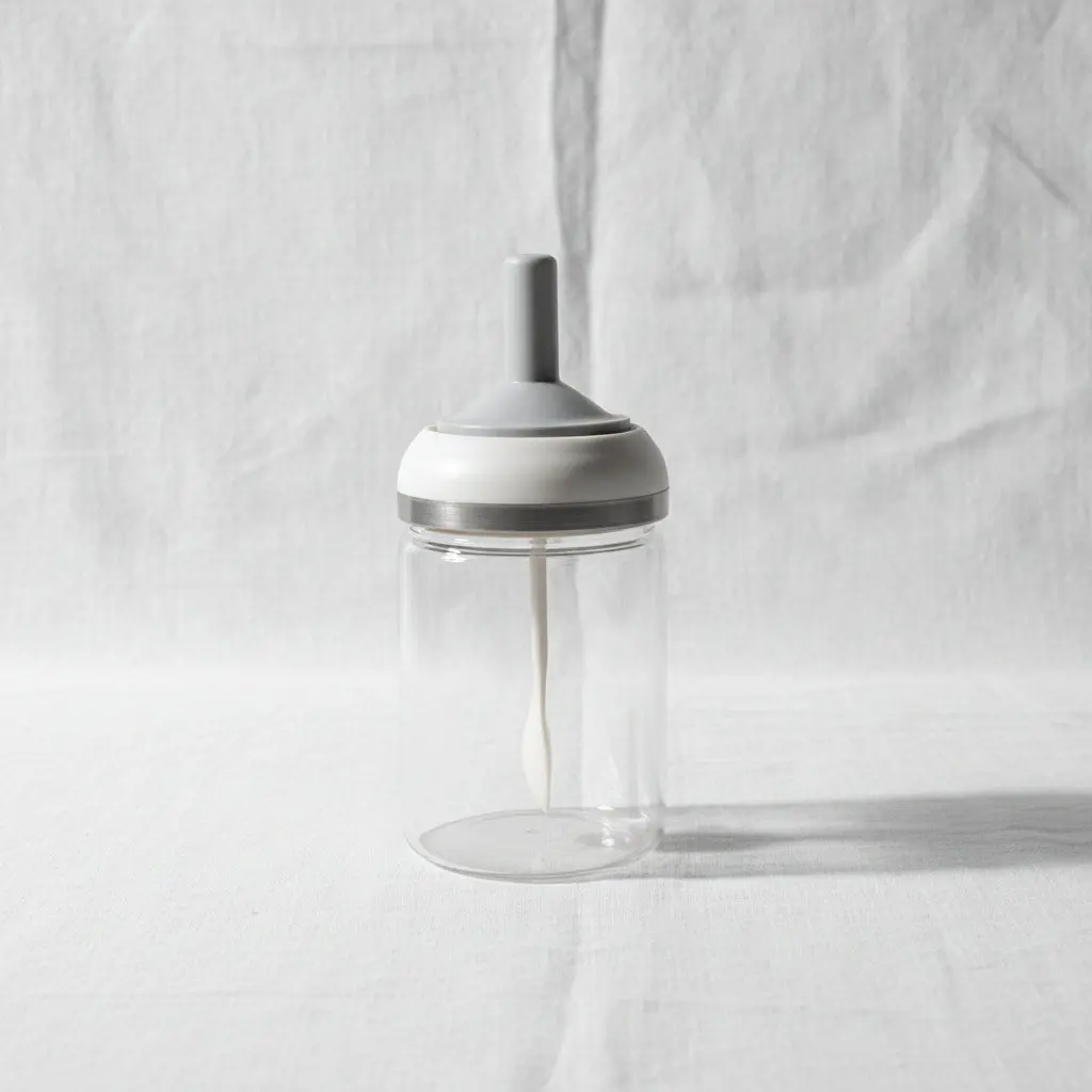 The Amber Flow Premium Glass Honey Jar with Integrated Lid & Spoon